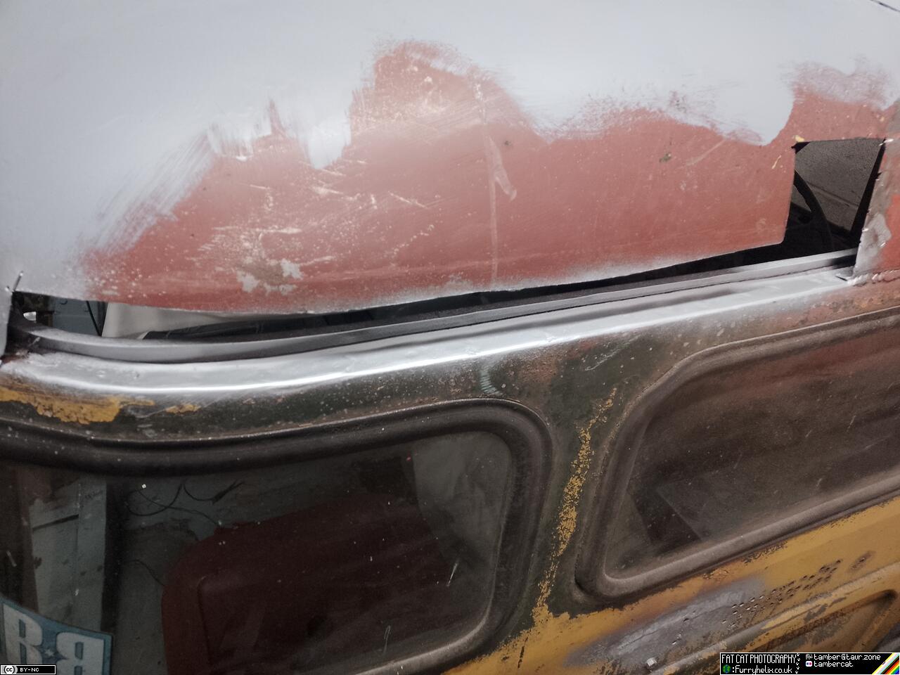 Cab roof with bare metal cleaned up and primed